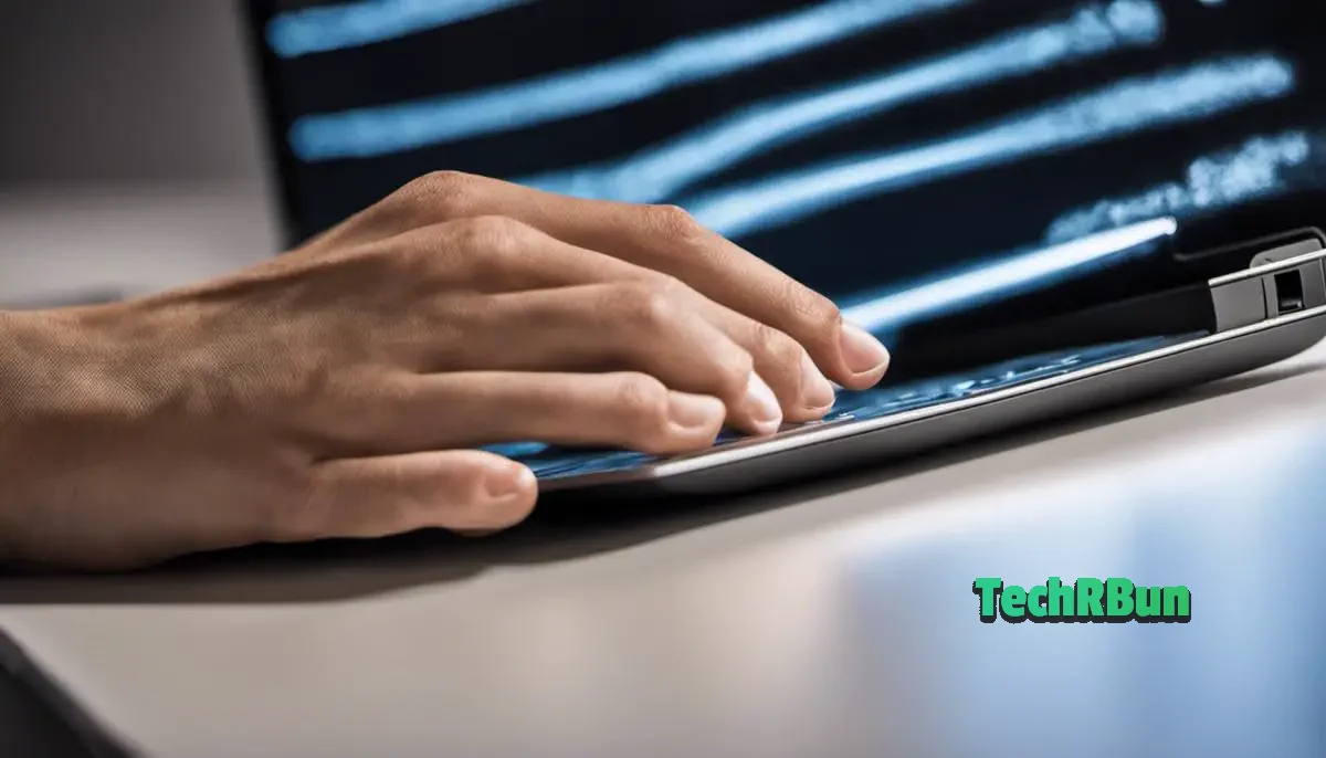 A laptop touchpad with a clean surface, being wiped with a cloth